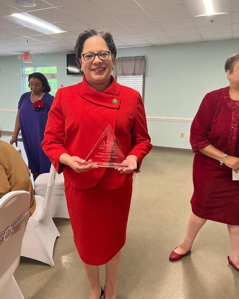 Rep. McClellan holds award at Delta Luncheon