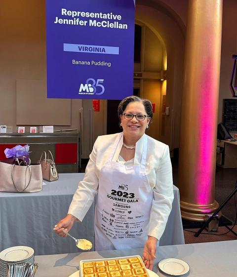 Rep. McClellan stands at her table behind her banana pudding