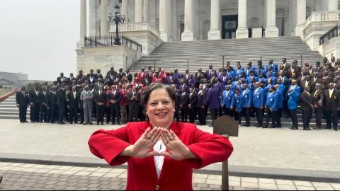 Rep. McClellan poses with Delta Sigma Theta Sorority Inc sign in front of D9 Fraternities