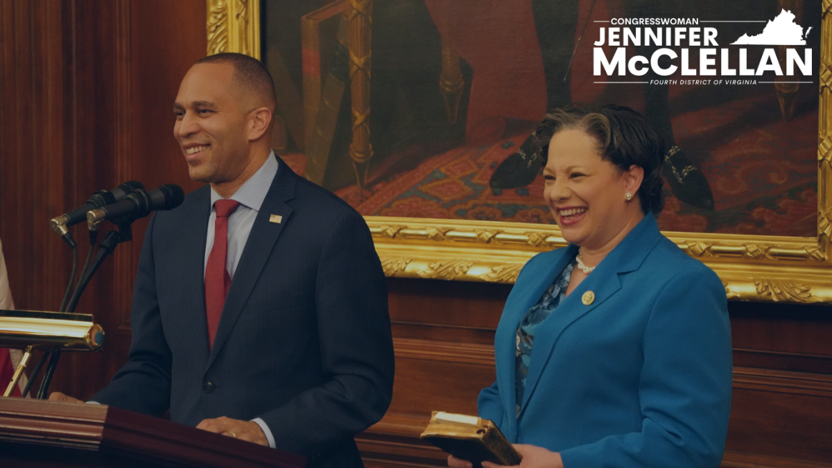 Congresswoman McClellan poses for her swearing-in photo with Minority Leader Jeffries.