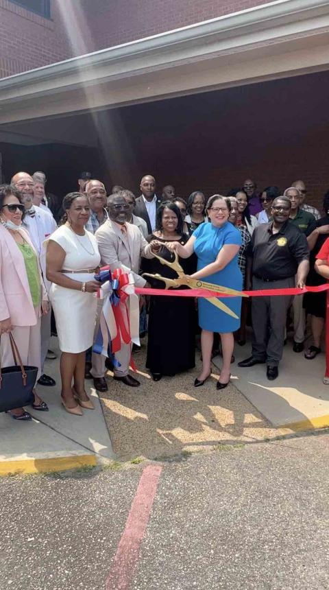Rep. McClellan cuts the ribbon at her new Brunswick office opening