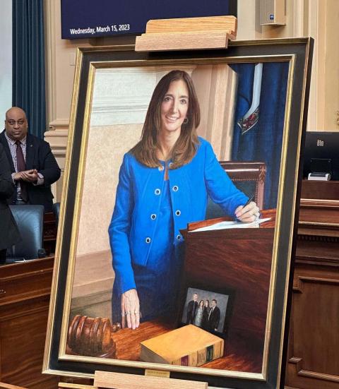 Portrait of Eileen Filler-Corn on easel in the chamber of the State Capitol.
