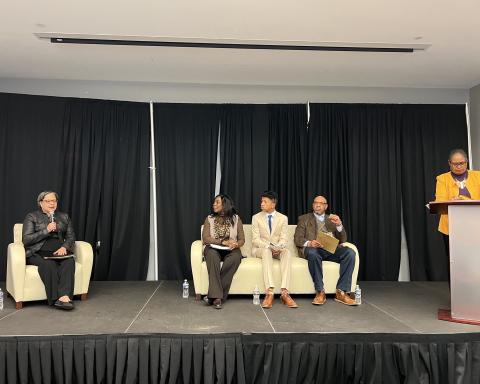 Rep. McClellan speaks on a stage with other participants for a panel discussion on voting rights