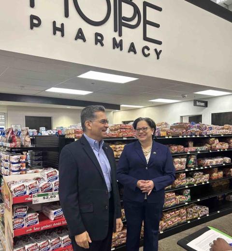 Rep. McClellan & Secretary Xavier Becerra stand in HOPE Pharmacy 