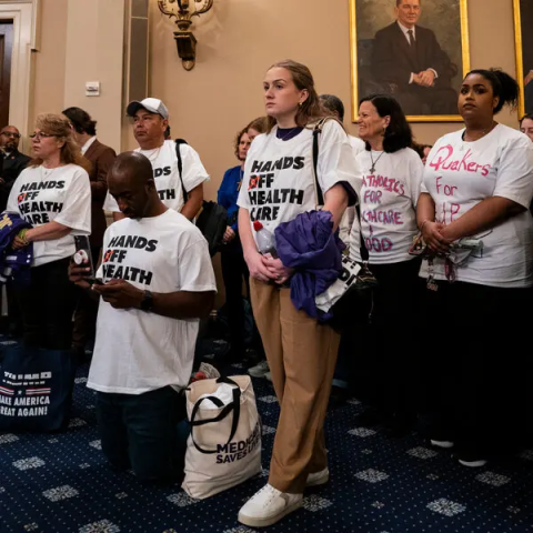 Image of Medicaid advocates standing at the House during the E&C markup.
