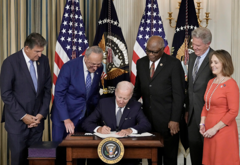 President Biden signs IRA.
