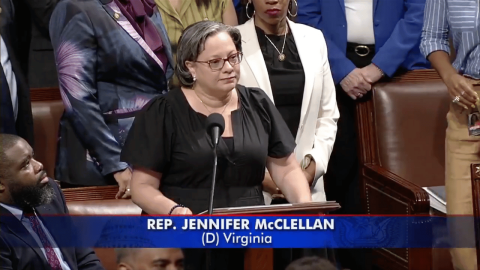Photo of Rep. McClellan speaking at the podium to protect Medicaid and SNAP alongside members of the CBC.