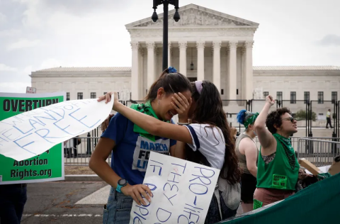 Photo of protesters mourning outside of the Supreme Court building after the Dobbs decision.