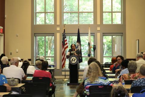 Photo of Rep. McClellan speaking in front of a packed room at her Chesterfield senior town hall.