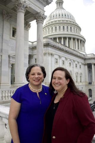 Photo of Rep. McClellan smiling with Erica in front of the Capitol.
