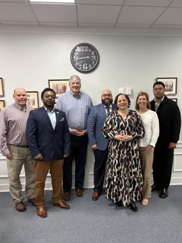 Photo of Rep. McClellan smiling with local officials from Surry, Sussex and the Town of Waverly.