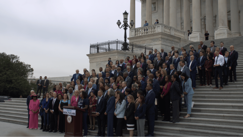 Photo of Rep. McClellan standing with House Dems on the Capitol steps hours before the shutdown.
