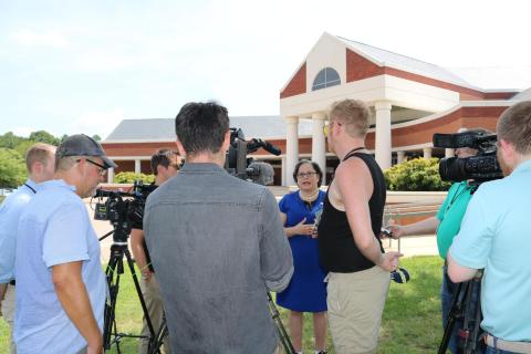 Photo of Rep. McClellan speaking with reporters outside of the Chesterfield Courthouse.