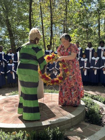 Photo of Rep. McClellan holding a wreath during a wreath-laying ceremony at Mount Vernon.