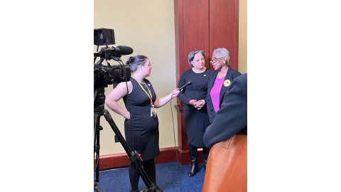 Image of Rep. McClellan and Jeanne Robinson speaking to a reporter.