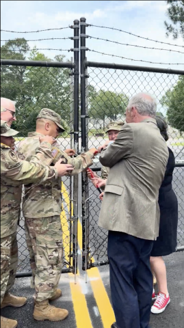 Photo of Rep. McClellan and Sen. Kaine helping open the public gate.