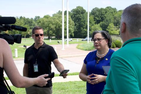 Photo of Rep. McClellan speaking with reporters outside of the Chesterfield Courthouse.